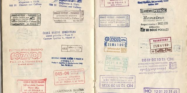 Pages of a passport covered with entry and exit stamps